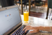 man typing on laptop