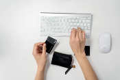 woman using credit cart to pay for eCommerce SEO Tools