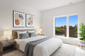 Bed sitting within a room of a house