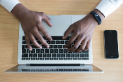 Man typing on a computer