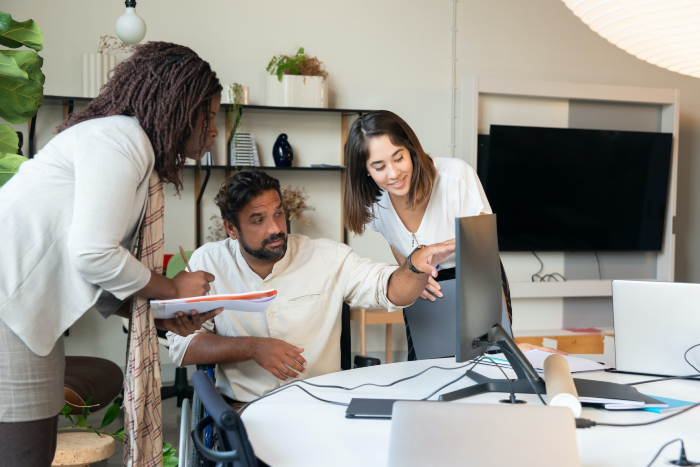 small business owners looking at computer