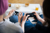 Couple playing a video game because of Video Game Marketing