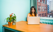 woman researching PPC management for small business on a laptop