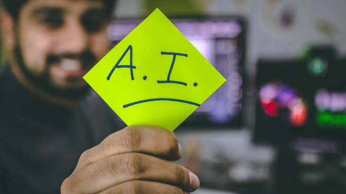 Man holding AI sign