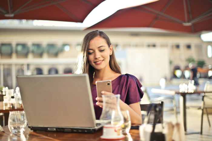Woman using laptop to learn PPC management for small business