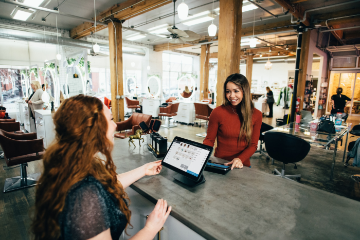 A person making a purchase at a small business