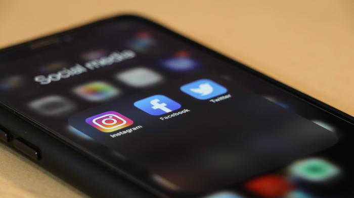 Social media apps showing on a phone in relation to real estate automation marketing