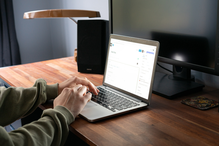 WordPress SEO Consultant scrolling on Laptop