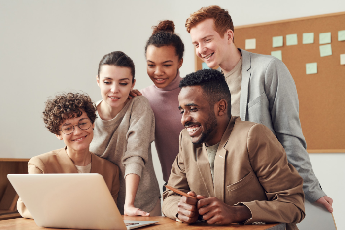 Group of people looking at computer screen