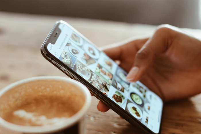 Person scrolling on social media for SaaS Digital Marketing