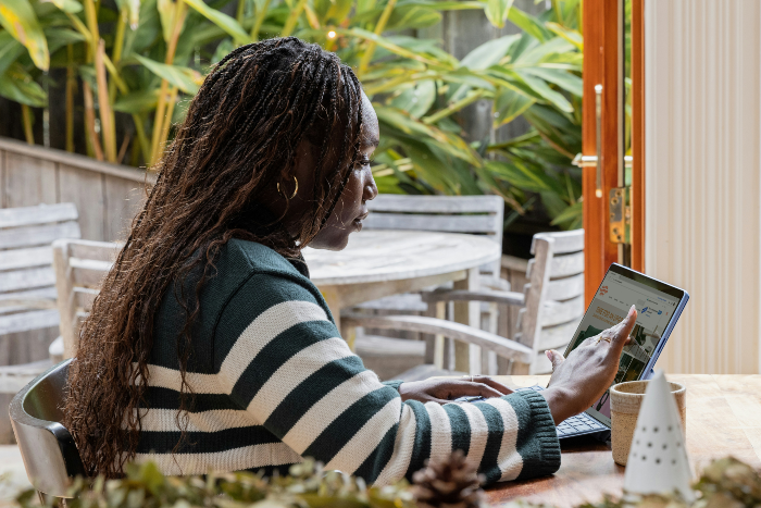 Woman resaerching on Outsourcing marketing for small businesses